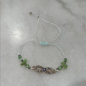 Elegant Green and Gold Infinity Bracelet